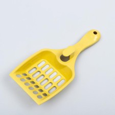 A scoop for a cat toilet 22.5 x 9.5 x 4 cm, light yellow