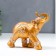 Souvenir Polystone "African elephant with palm trees" aged gold 14x7x16.5 cm