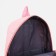 A backpack with a zipper, 3 outer pockets, pink color