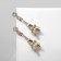Earms with Eiffel Tower Rhinas, white color in gold