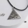 Piece on the lace "Eye RA", color black silver on a black lace, 44 cm