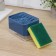 A dispenser for a detergent with a sponge stand, 250 ml, a sponge in the kit, the color is blue