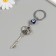 Keychain from the evil eye Metal "key with crown" 3x8.2 cm