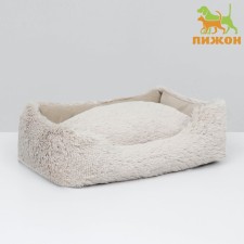 A sunbed with a pillow 