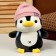 Soft toy "Penguin" with a backpack, in a pink hat, 22 cm