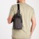 Male sling bag from textiles, headphone opening, gray color