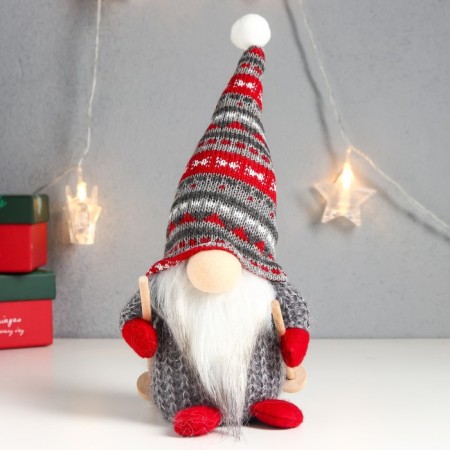 Interior doll "Santa Claus with ski sticks, a gray cap with patterns" 27x12x8 cm