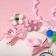 Set of children's "chosen" 6 items: 2 elastic bands, clips, beads, bracelet, felt -tip pen, kitten, color