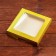 Self -charged box, with a window, gold, 16 x 16 x 3 cm