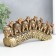 Polystone souvenir "Seven elephants on a tusk with colors" Bronze 21x4x9.8 cm