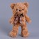 Soft toy "Bear" with a checkered bow, 30 cm, brown color