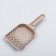 A scoop for cleaning a cat toilet, beige