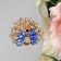 Brooch "Peacock" with a fluffy tail, the color is blue in gold