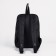 A backpack with a zipper, "saxi", outer pocket, black color