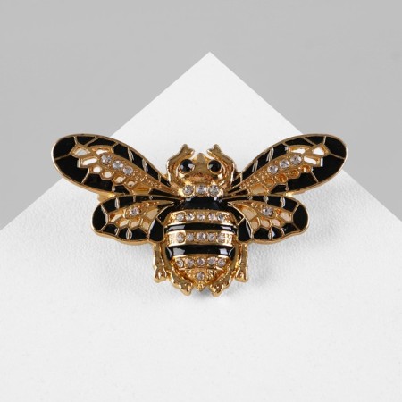 Brooch "Bee" with openwork wings, black and white color in gold