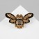 Brooch "Bee" with openwork wings, black and white color in gold