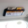 Busman on a visor with a mobile phone number, black