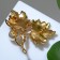 Brooch "Maple leaves", color in gold