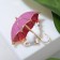 Brooch "Cat" under an umbrella, white-pink color in gold