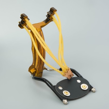 A slingshot with a plastic handle, with an emphasis-1