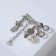 Brooch "Scissors with pendants", white color in silver