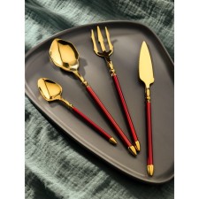 A set of cutlery made of stainless steel Magistro Ocean, 4 objects, the color of the metal of the gold, the handle is red