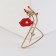 Brooch "Silhouette", red color in gold