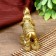 NECK Polystone "Elephant with coins" of bronze 8.5x8 cm