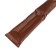 A car pillow between the seat and the armrest, brown
