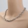 The necklace "chain" is oval links, the color is matte silver, 45 cm