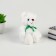 Soft toy "Bear", with a green bow
