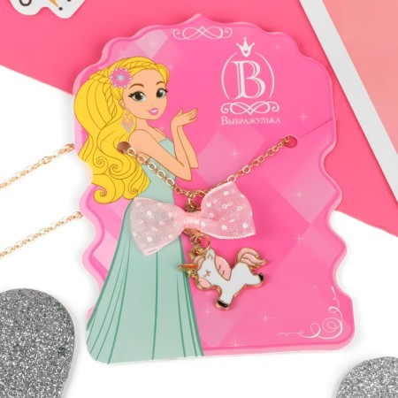 Children's pendant "chosen" unicorn with a bow, white-pink color in gold-2