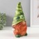 The piggy bank "Gnome Scandil" is height 22.5 cm, width 9.5 cm, length 11.5 cm.