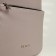A backpack with a zipper, Textura, external pocket, gray-beige color
