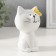 Souvenir Ceramics "White cat with yellow flowers on the ear, sits" 7.2x6.5x10.3 cm