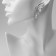 Earrings with rhinestones "bows" wings, white color in silver