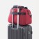 Road bag on lightning, 2 external pockets, a suitcase holder, a long belt, burgundy color