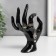 Souvenir polystone stand for jewelry "Hand" black 16.5x8 cm