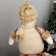 Soft toy "Snowman in sequins - long legs" sits, 13x52 cm, brown