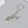 Metal keychain "Bunny with a butterfly on the nose" 5x3.4 cm