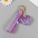 A keychain plastic with a carbine, a strap "Heart with flowers" Water with a decor 5x5x2.5 cm