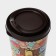 A plastic glass with a “izi-go” lid, 550 ml, 9.3 × 9.1 × 15.8 cm, a mix decor, a dark brown color