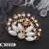 Brooch "Peacock" with a fluffy tail, white-radiant color in gold