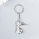 Metal key "Moped" silver 3.6x4.9 cm