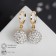 Earrings with “Shambhala” rhinestones, white color in gold