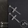 Earrings with rhinestones "crosses" stripes, white color in silver