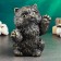 The piggy bank "joyful cat" is black, gold, 20cm