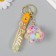A plastic keychain with a carbine, a strap "Flying Base of a star" Water with decor1.8x5.3x5.6 cm