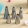 Set of confectionery “norm”, 13 objects: forceps, 8 nozzles, confectionery bag, adapter, measuring spoons, confectionery nail