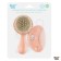 Soft comb, a comb and a scallop with a pile of sheep's wool, peach color